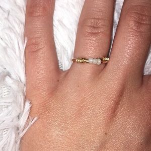 Gold and white seed bead ring.